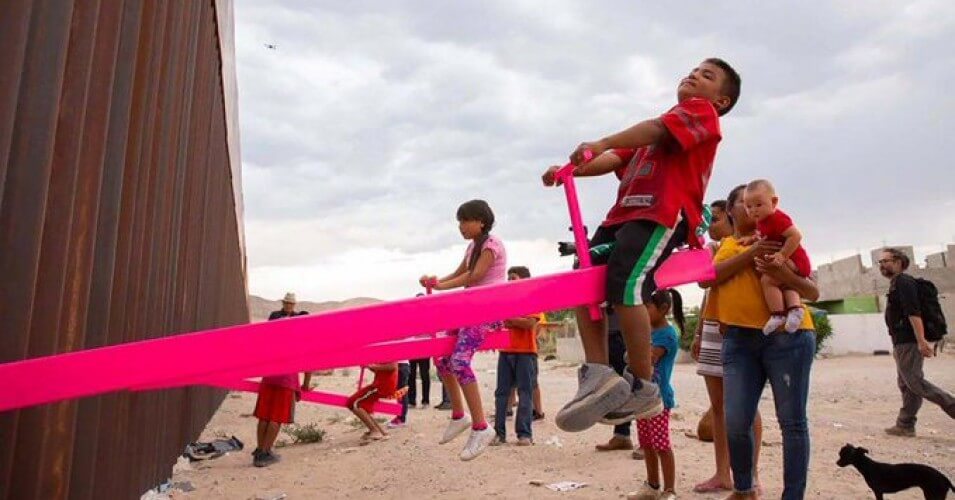 In Joyful Act of Resistance, Pink Seesaws Installed at Border Fence